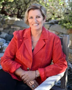  Beth red coat seated 